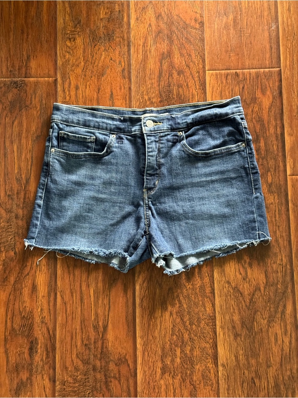 Levi's Raw Hem Denim Shorts in Blue